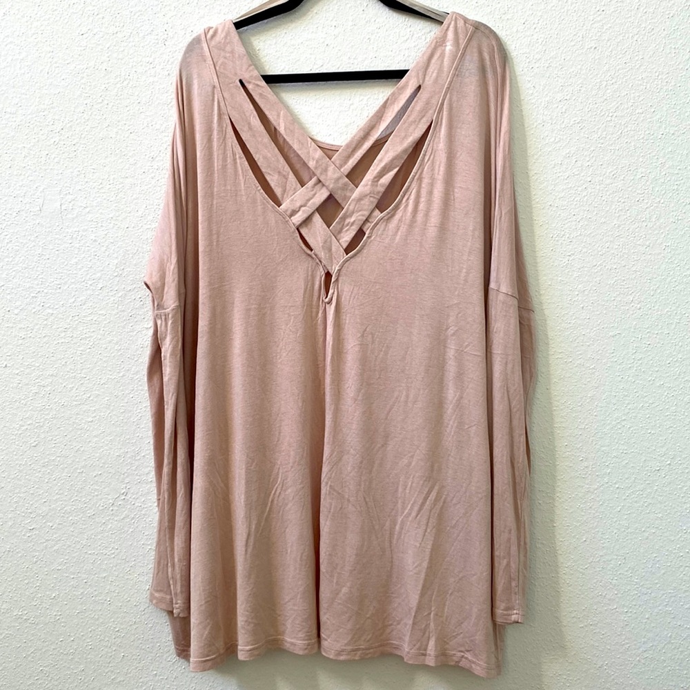 Pale pink long sleeved tunic with crisscross detail on back